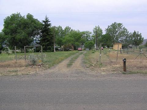 1220 Slavin Road Yakima, WA 98903 - Photo 1 of 9 a backyard of a house with lots of green space