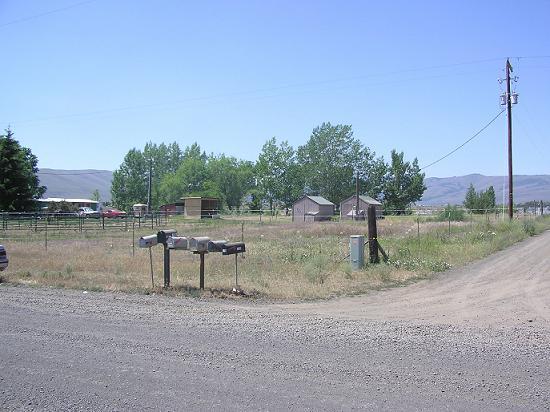1220 Slavin Road Yakima, WA 98903 - Photo 7 of 9 a view of a lake with a yard and entertaining space