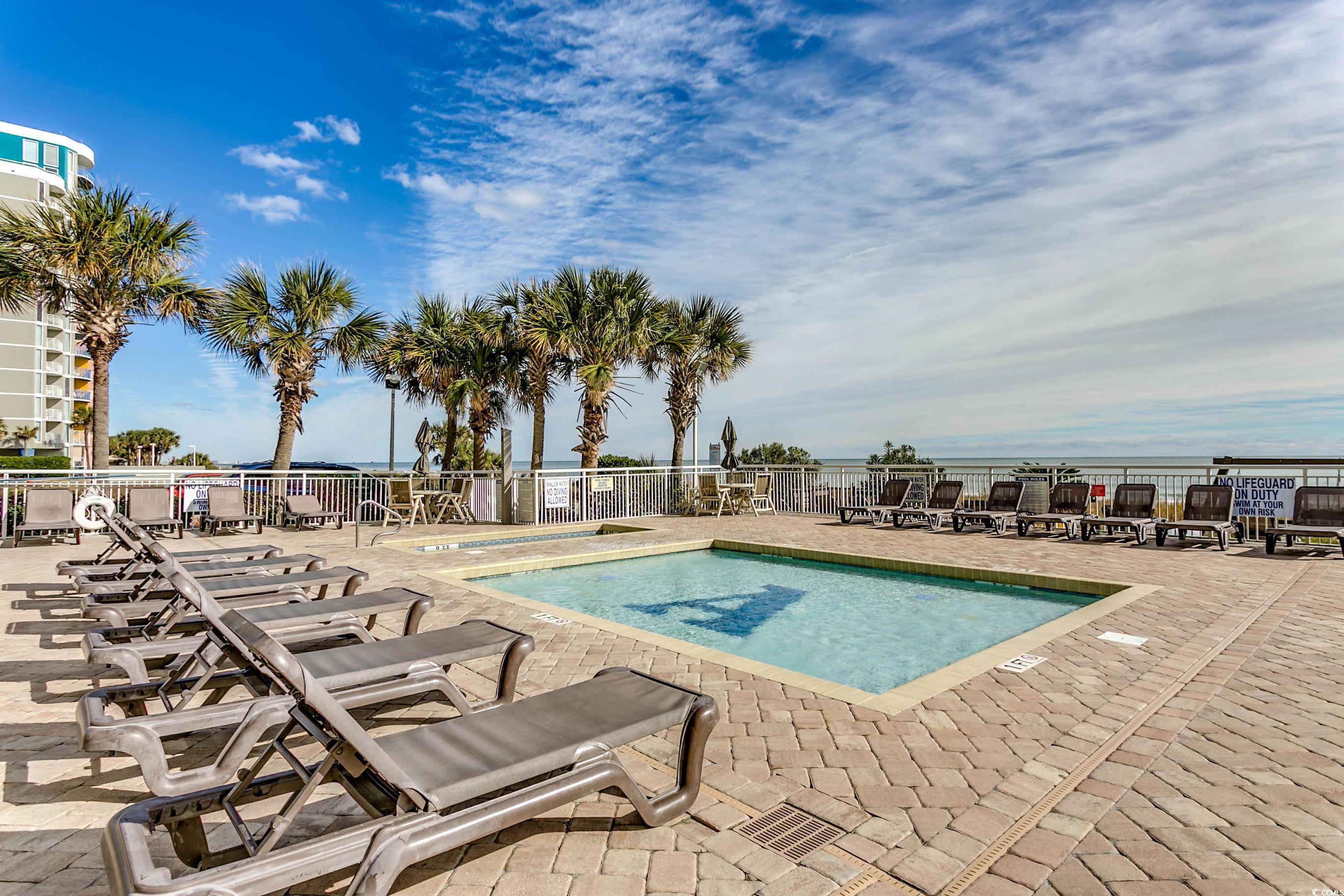 1702 North Ocean Boulevard, Unit 355 Myrtle Beach, SC 29577 - Photo 18 of 27 Community pool with a patio area