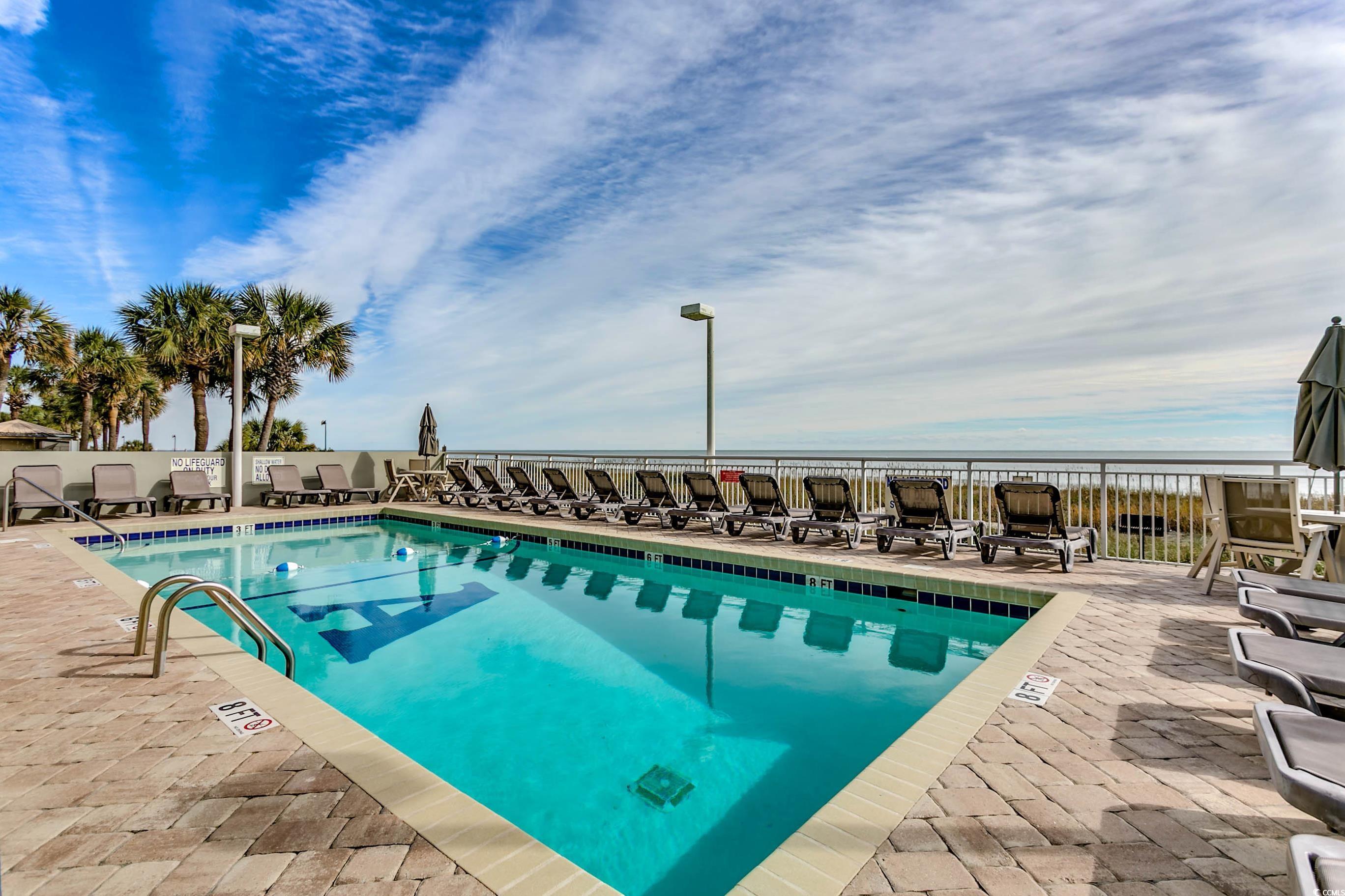 1702 North Ocean Boulevard, Unit 355 Myrtle Beach, SC 29577 - Photo 21 of 27 Community pool featuring a patio area