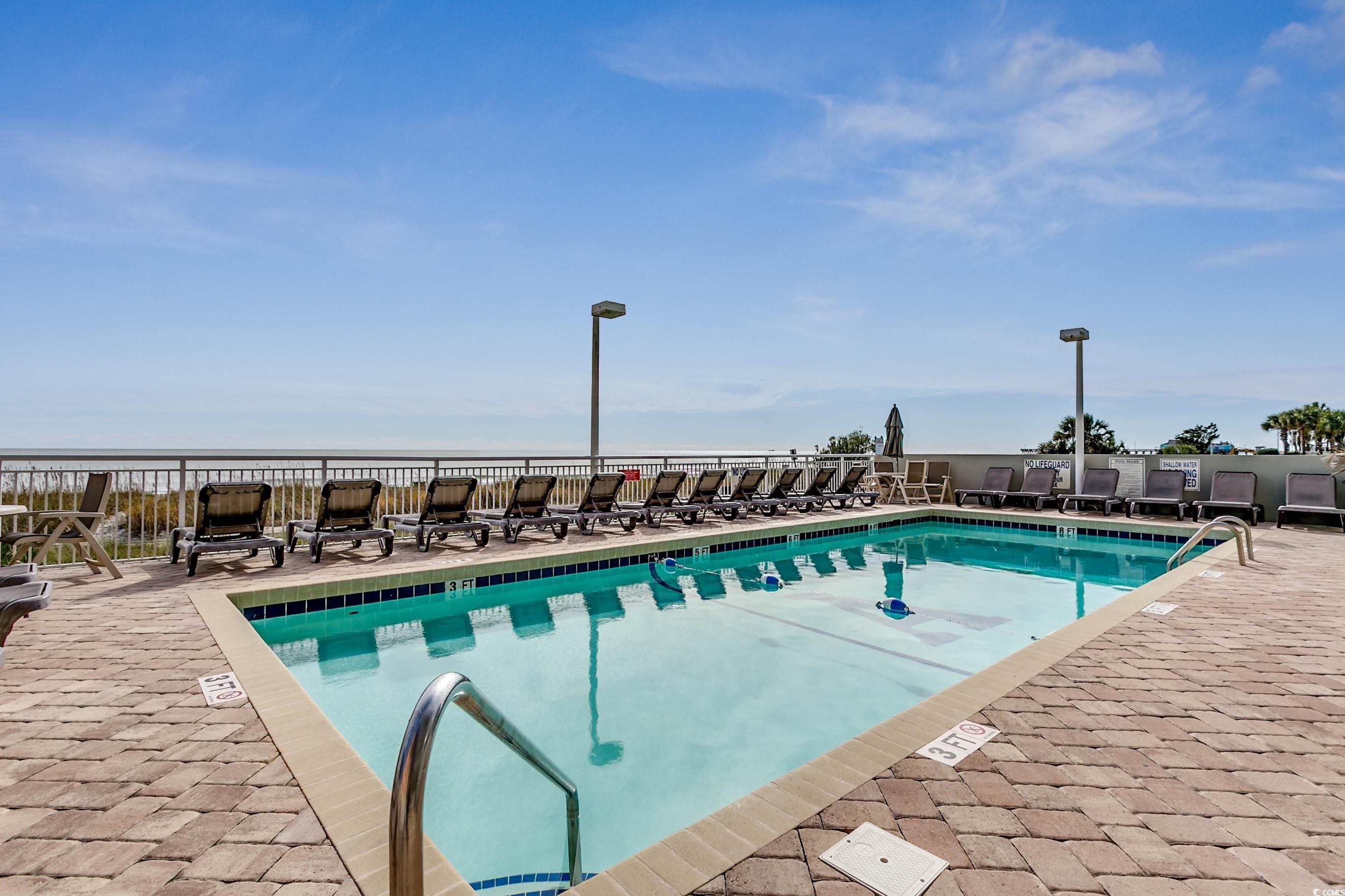 1702 North Ocean Boulevard, Unit 355 Myrtle Beach, SC 29577 - Photo 22 of 27 Community pool featuring a patio