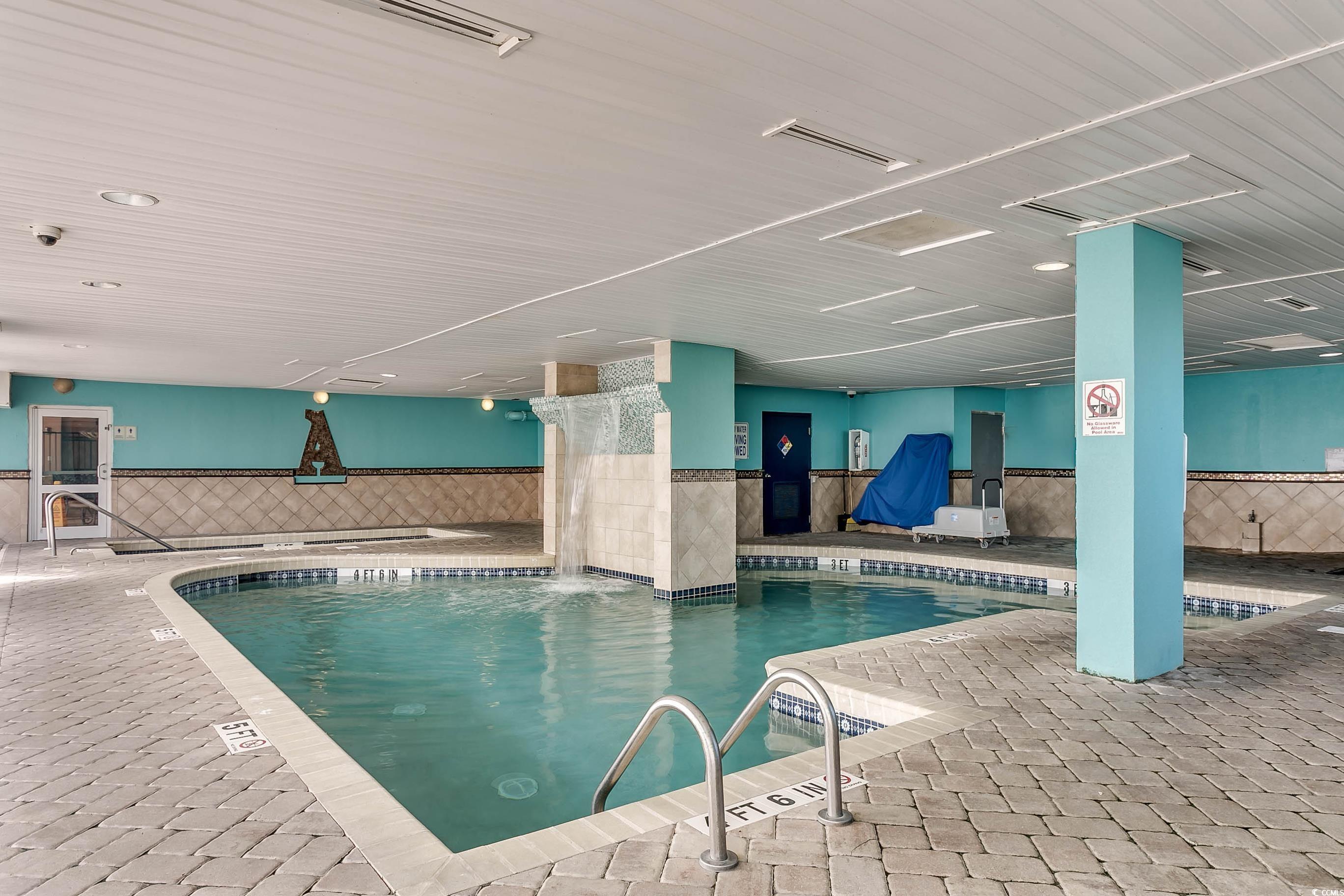 1702 North Ocean Boulevard, Unit 355 Myrtle Beach, SC 29577 - Photo 24 of 27 Indoor community pool featuring a patio