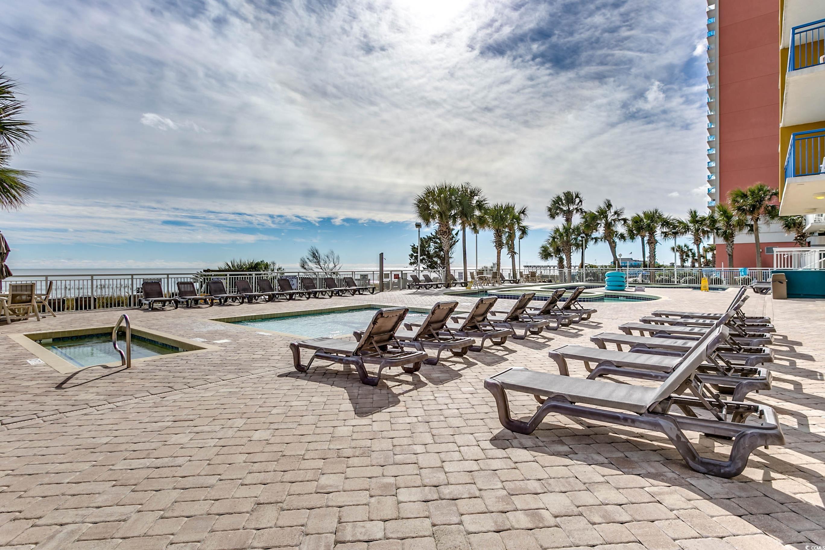 1702 North Ocean Boulevard, Unit 355 Myrtle Beach, SC 29577 - Photo 25 of 27 Community pool with a patio