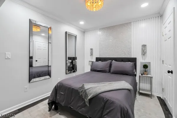 a bedroom with a bed and a lamp