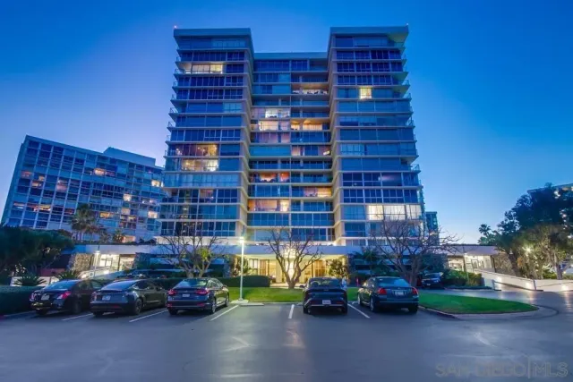 a view of a swimming pool with outdoor seating