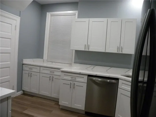 a kitchen with a sink and cabinets
