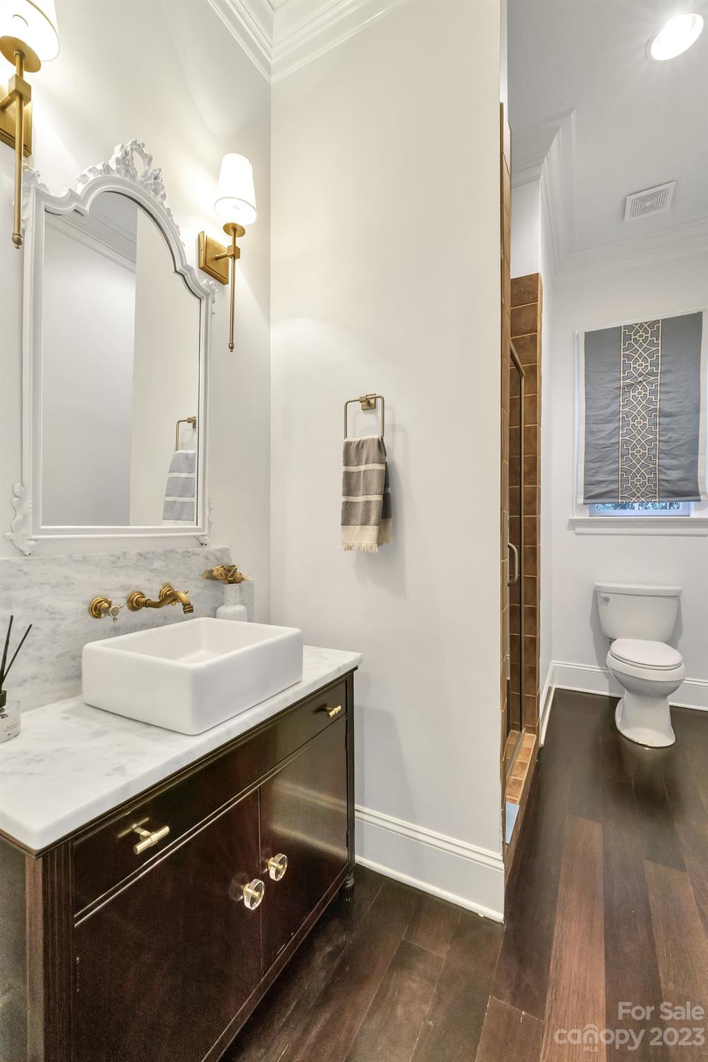 407 Bullfinch Bend Fort Mill, SC 29708 - Photo 12 of 46 a bathroom with a sink and a mirror