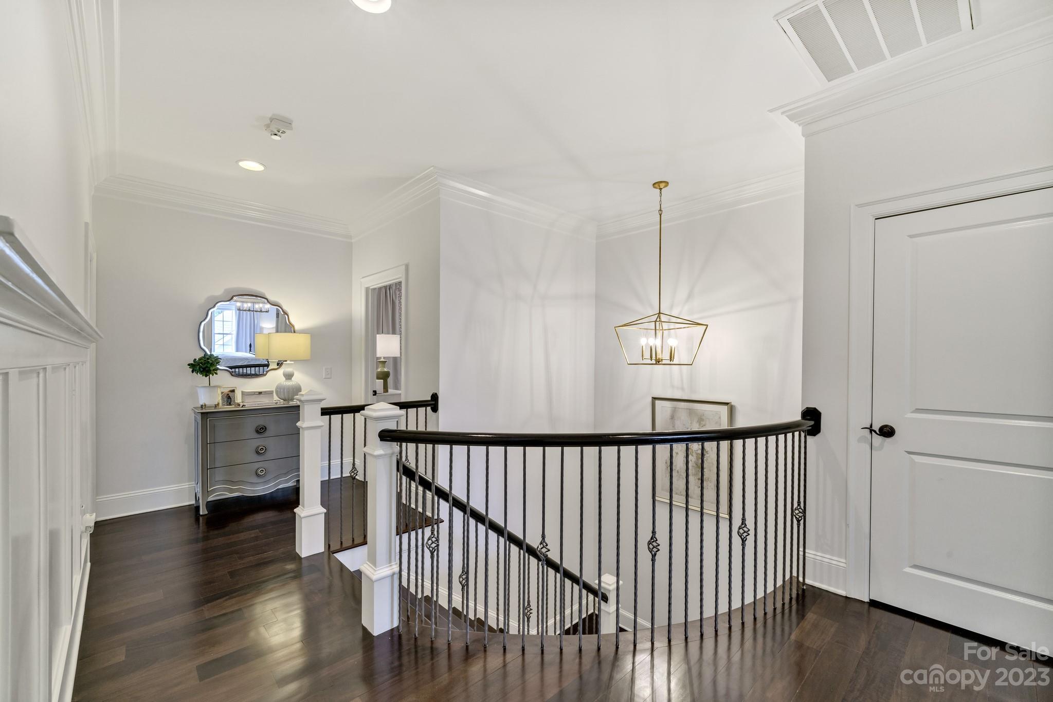407 Bullfinch Bend Fort Mill, SC 29708 - Photo 30 of 46 a view of a hallway view with wooden floor and staircase