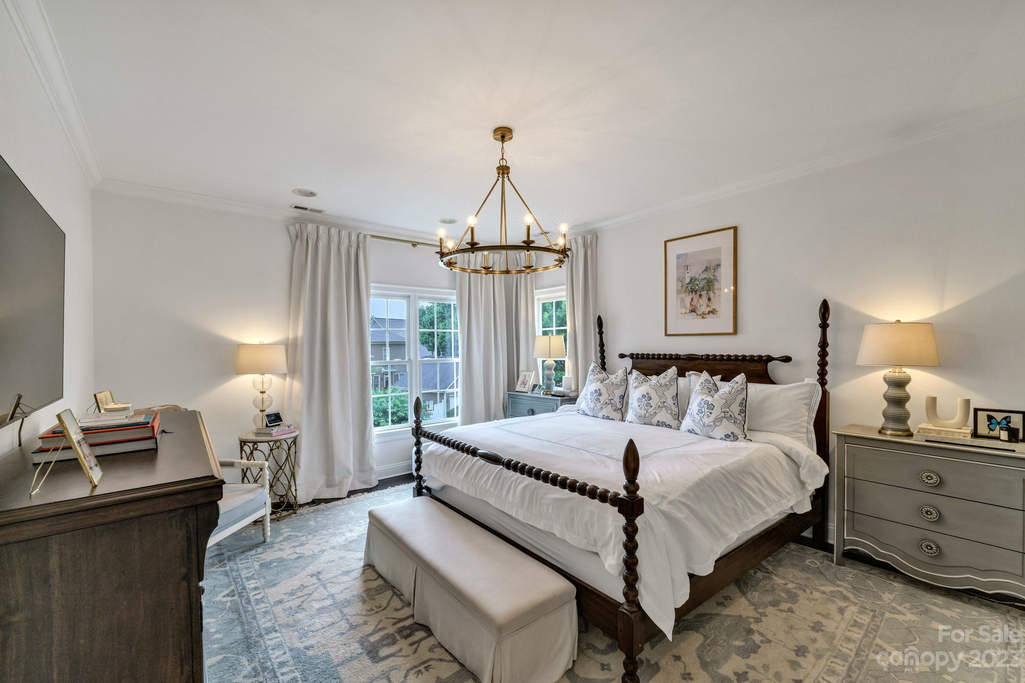 407 Bullfinch Bend Fort Mill, SC 29708 - Photo 31 of 46 a bedroom with a bed and wooden floor