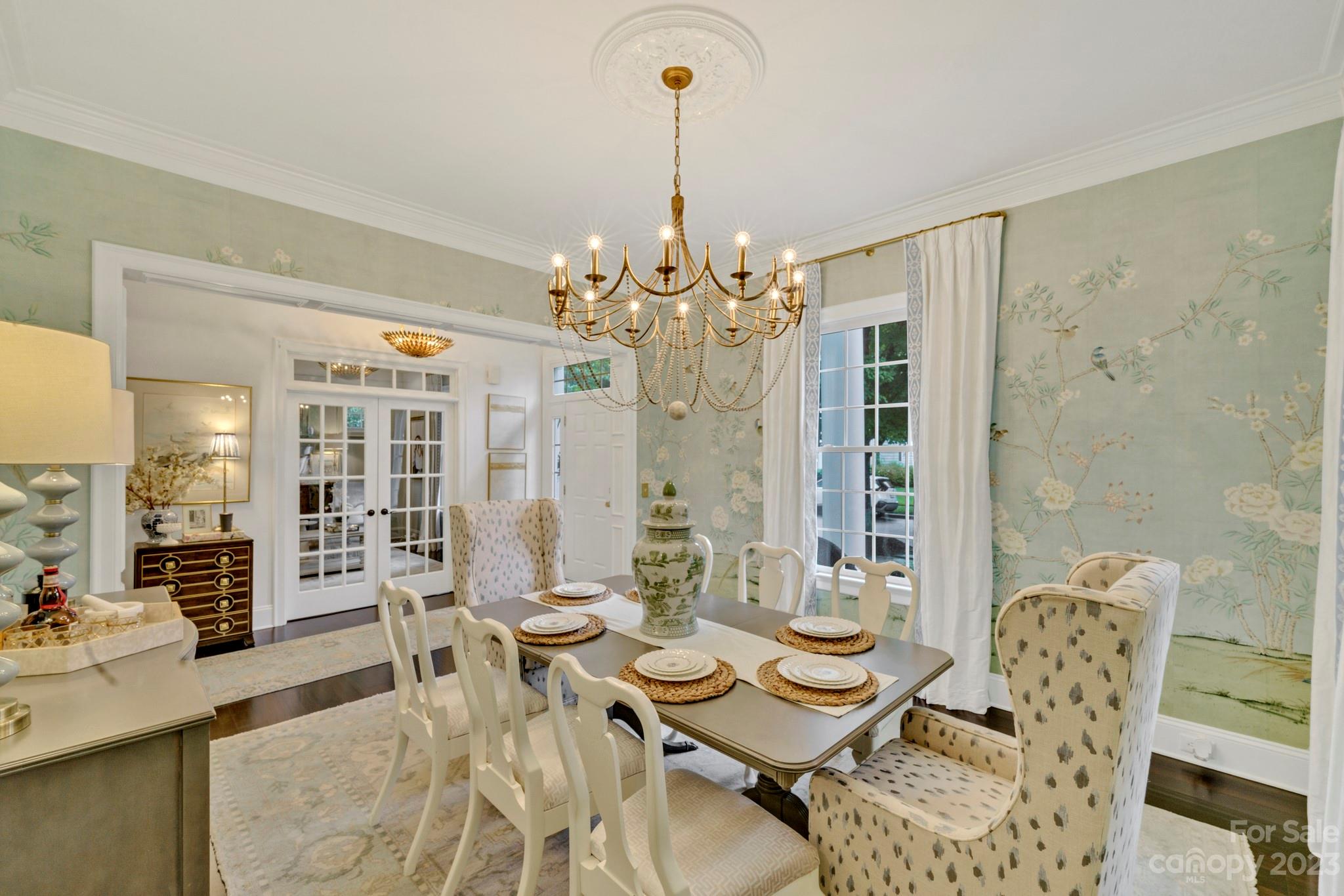 407 Bullfinch Bend Fort Mill, SC 29708 - Photo 4 of 46 a view of a dining room with furniture and chandelier