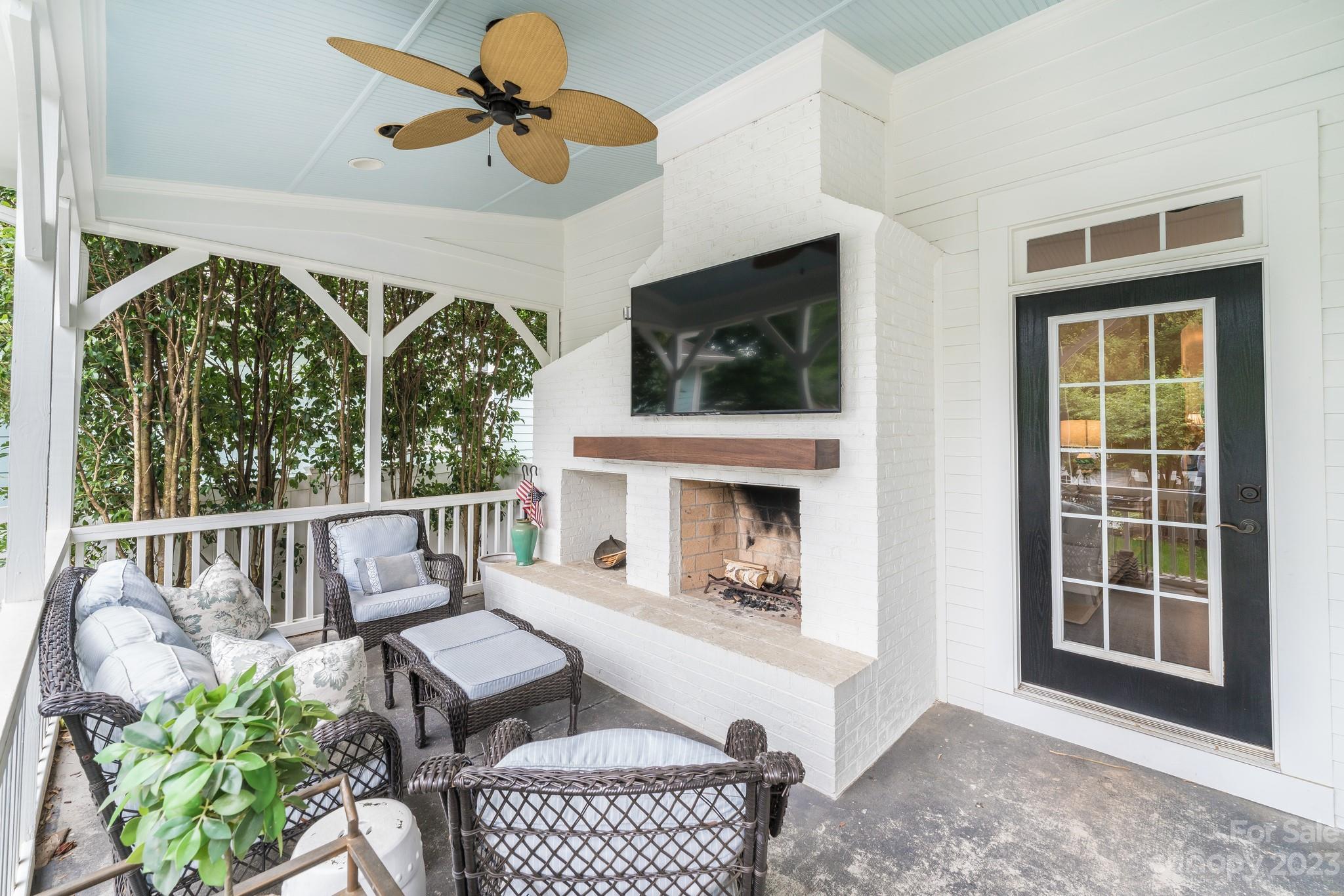 407 Bullfinch Bend Fort Mill, SC 29708 - Photo 41 of 46 a living room with furniture fireplace and flat screen tv