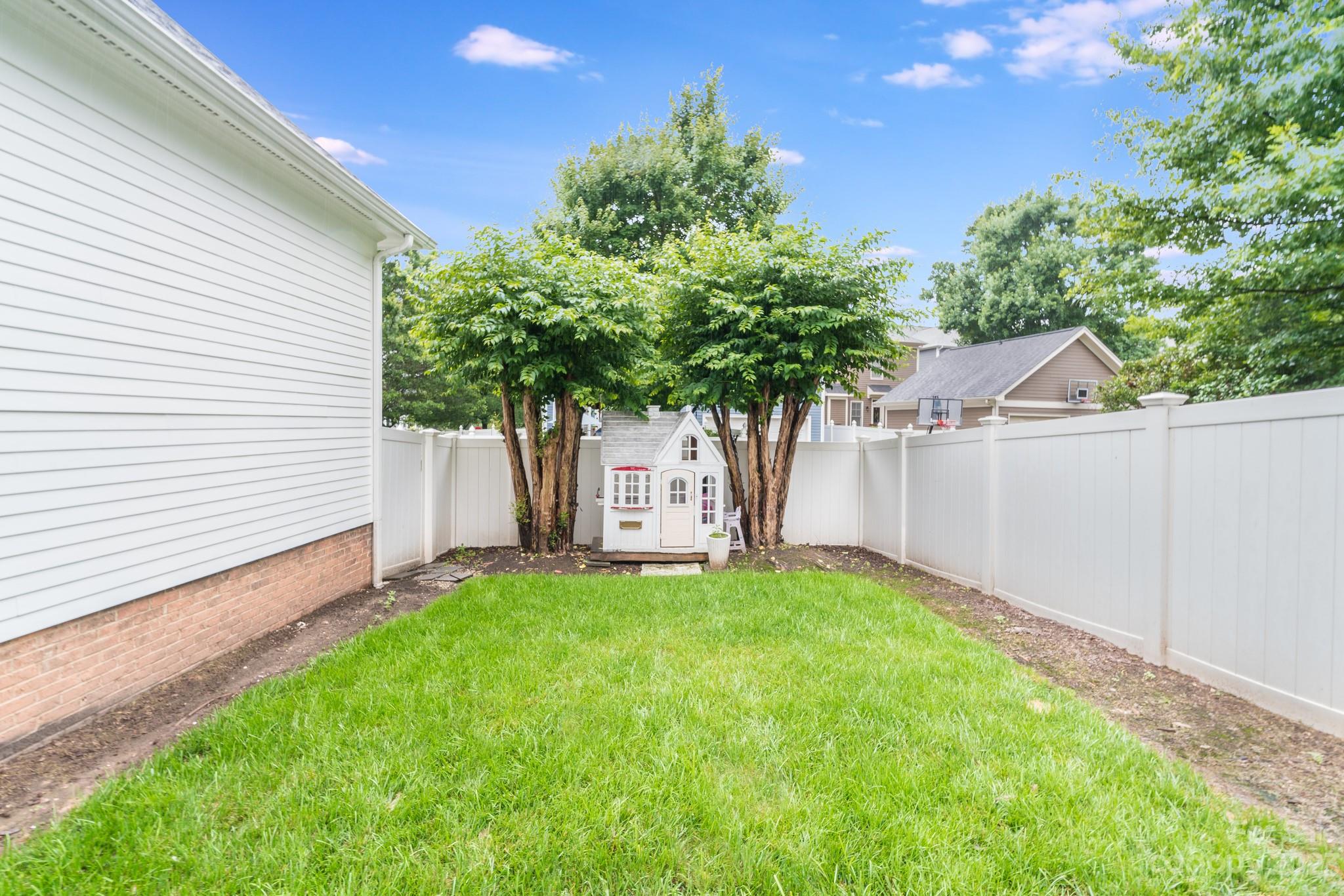 407 Bullfinch Bend Fort Mill, SC 29708 - Photo 46 of 46 a house that has a tree in front of the house