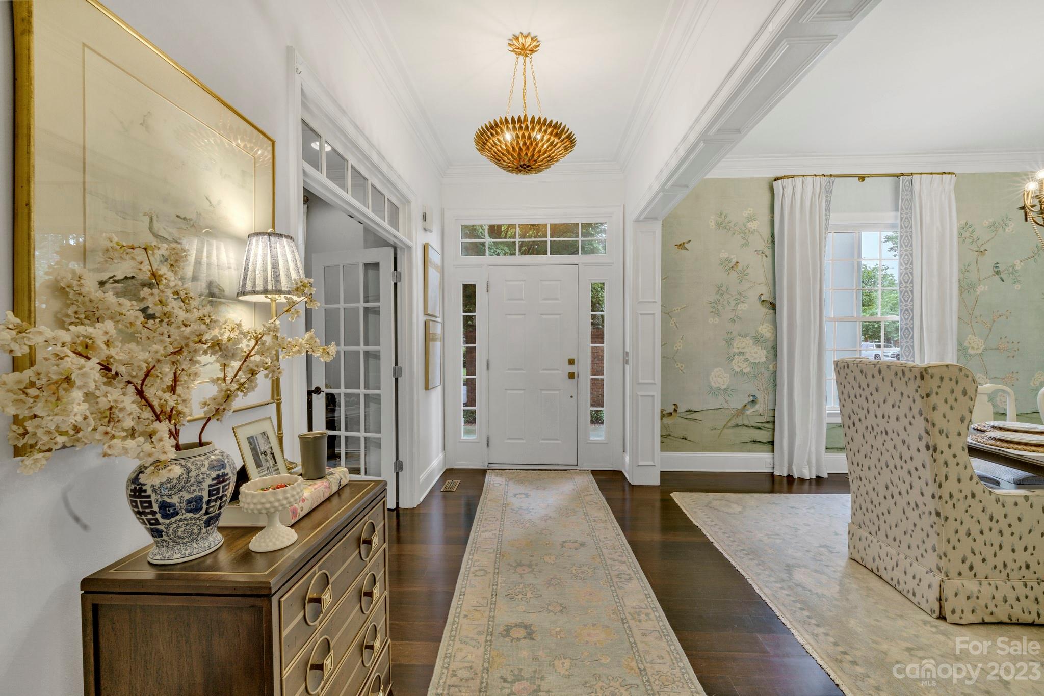 407 Bullfinch Bend Fort Mill, SC 29708 - Photo 8 of 46 a dining room with furniture and a chandelier