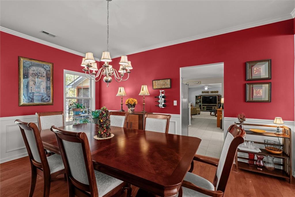 130 Chadwick Place Villa Rica, GA 30180 - Photo 18 of 55 a view of a dining room with furniture and chandelier