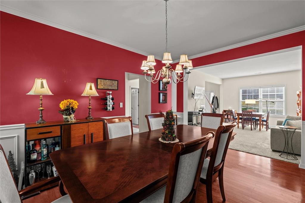 130 Chadwick Place Villa Rica, GA 30180 - Photo 19 of 55 a view of a dining room with furniture and chandelier