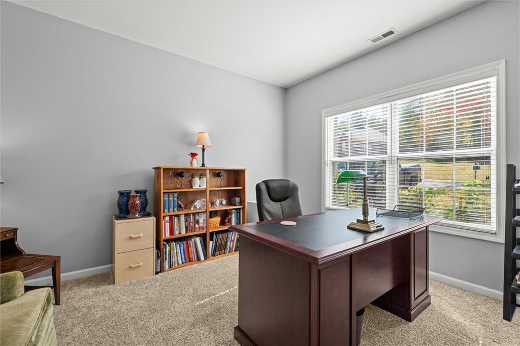 130 Chadwick Place Villa Rica, GA 30180 - Photo 21 of 55 a view of a workspace with furniture and a window