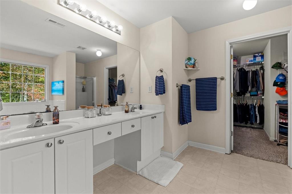 130 Chadwick Place Villa Rica, GA 30180 - Photo 26 of 55 a bathroom with double vanity and a sink