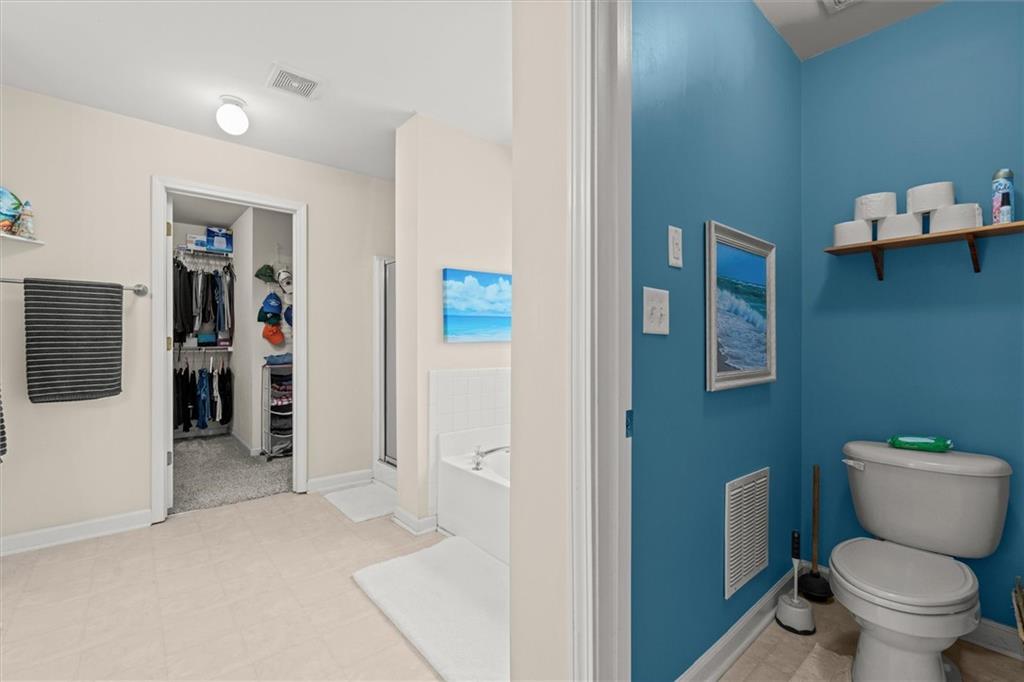 130 Chadwick Place Villa Rica, GA 30180 - Photo 28 of 55 a bathroom with a toilet sink and mirror