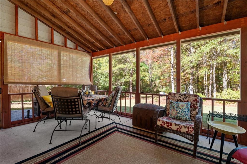 130 Chadwick Place Villa Rica, GA 30180 - Photo 39 of 55 a living room with furniture and a floor to ceiling window
