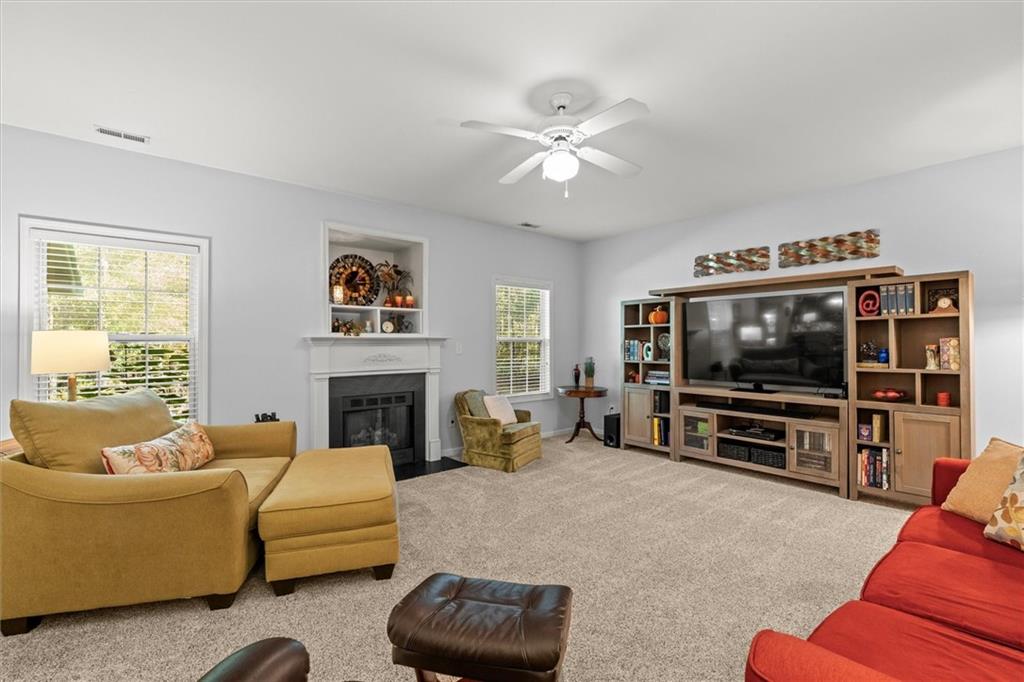 130 Chadwick Place Villa Rica, GA 30180 - Photo 9 of 55 a living room with furniture and a flat screen tv