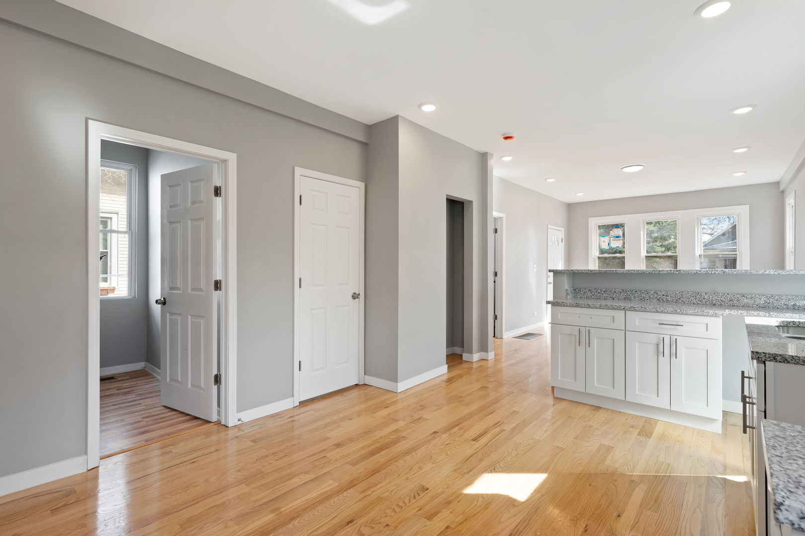 8048 South Avalon Avenue Chicago, IL 60619 - Photo 12 of 17 a open kitchen with granite countertop a refrigerator and a sink