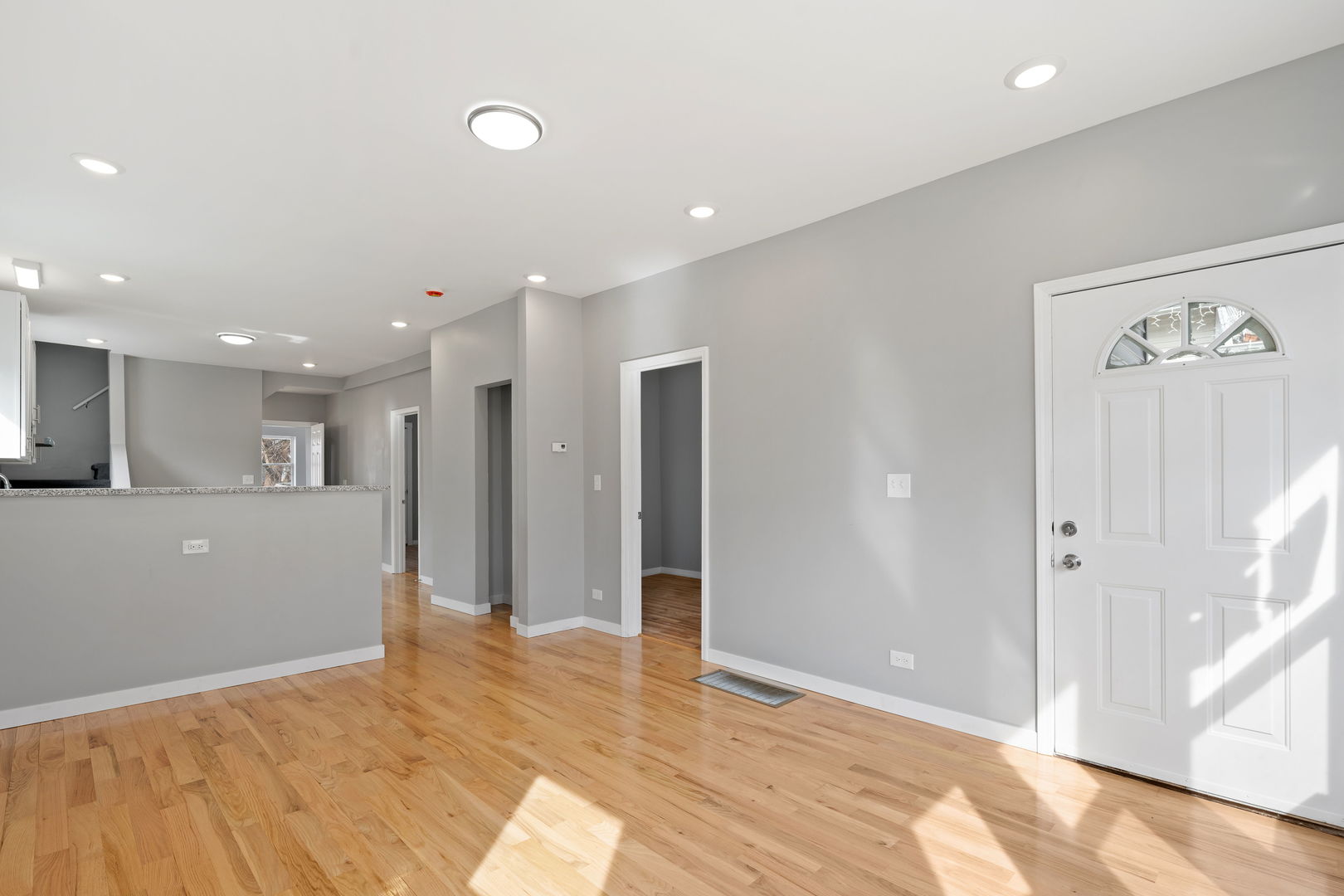 8048 South Avalon Avenue Chicago, IL 60619 - Photo 16 of 17 a view of an empty room with wooden floor