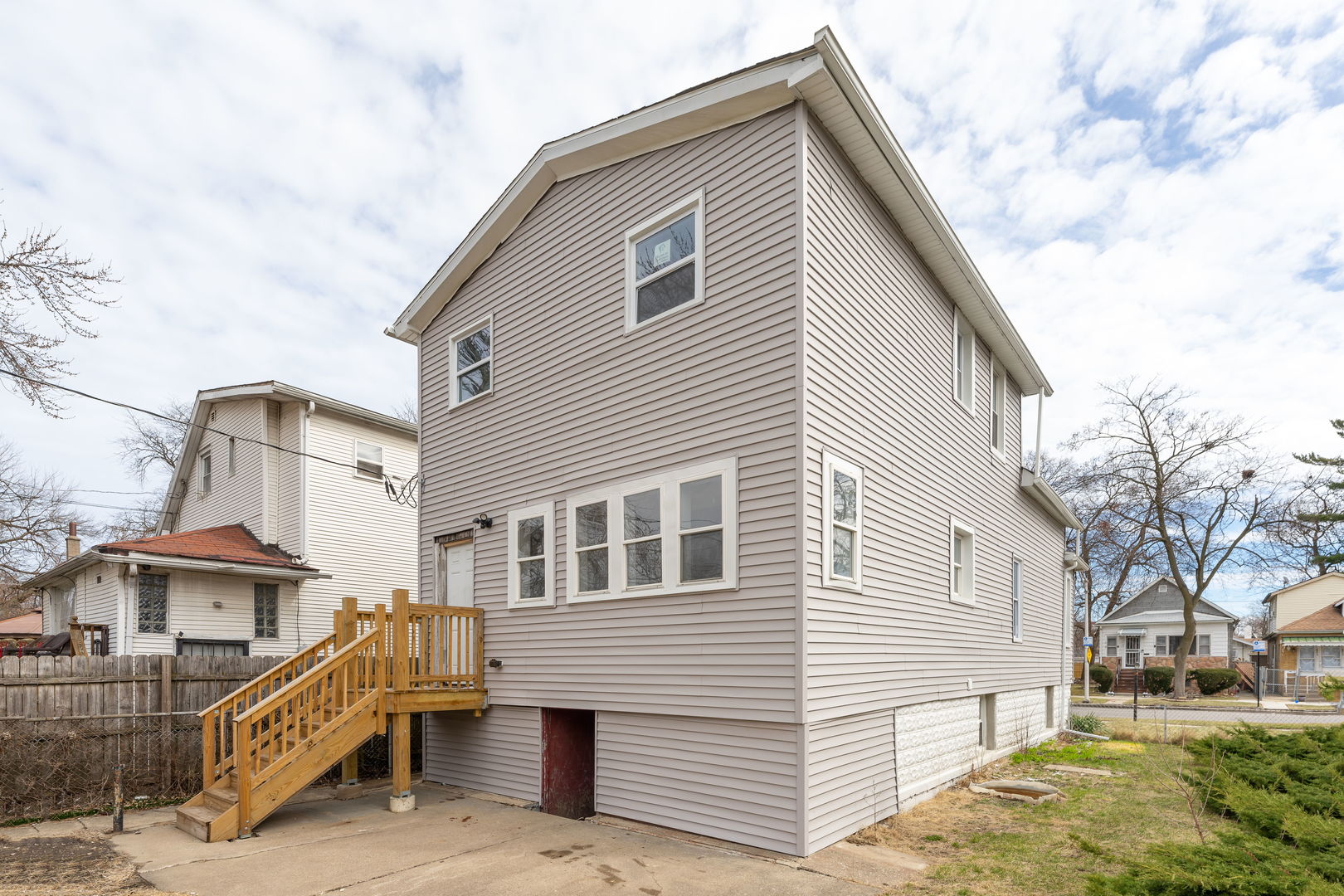 8048 South Avalon Avenue Chicago, IL 60619 - Photo 2 of 17 a view of a house with a yard