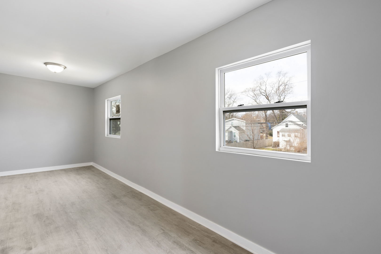 8048 South Avalon Avenue Chicago, IL 60619 - Photo 3 of 17 an empty room with windows