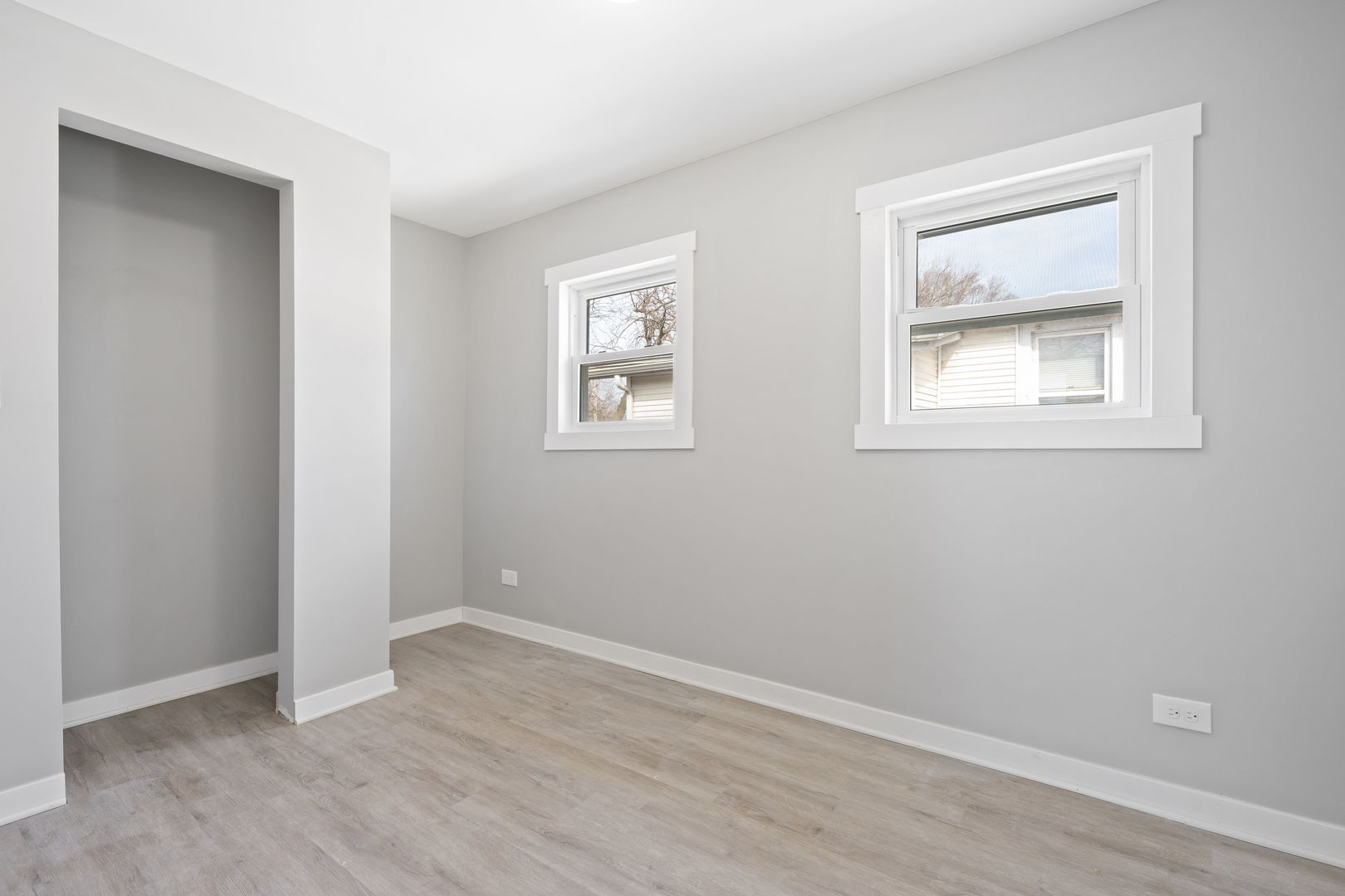 8048 South Avalon Avenue Chicago, IL 60619 - Photo 7 of 17 an empty room with windows and closet