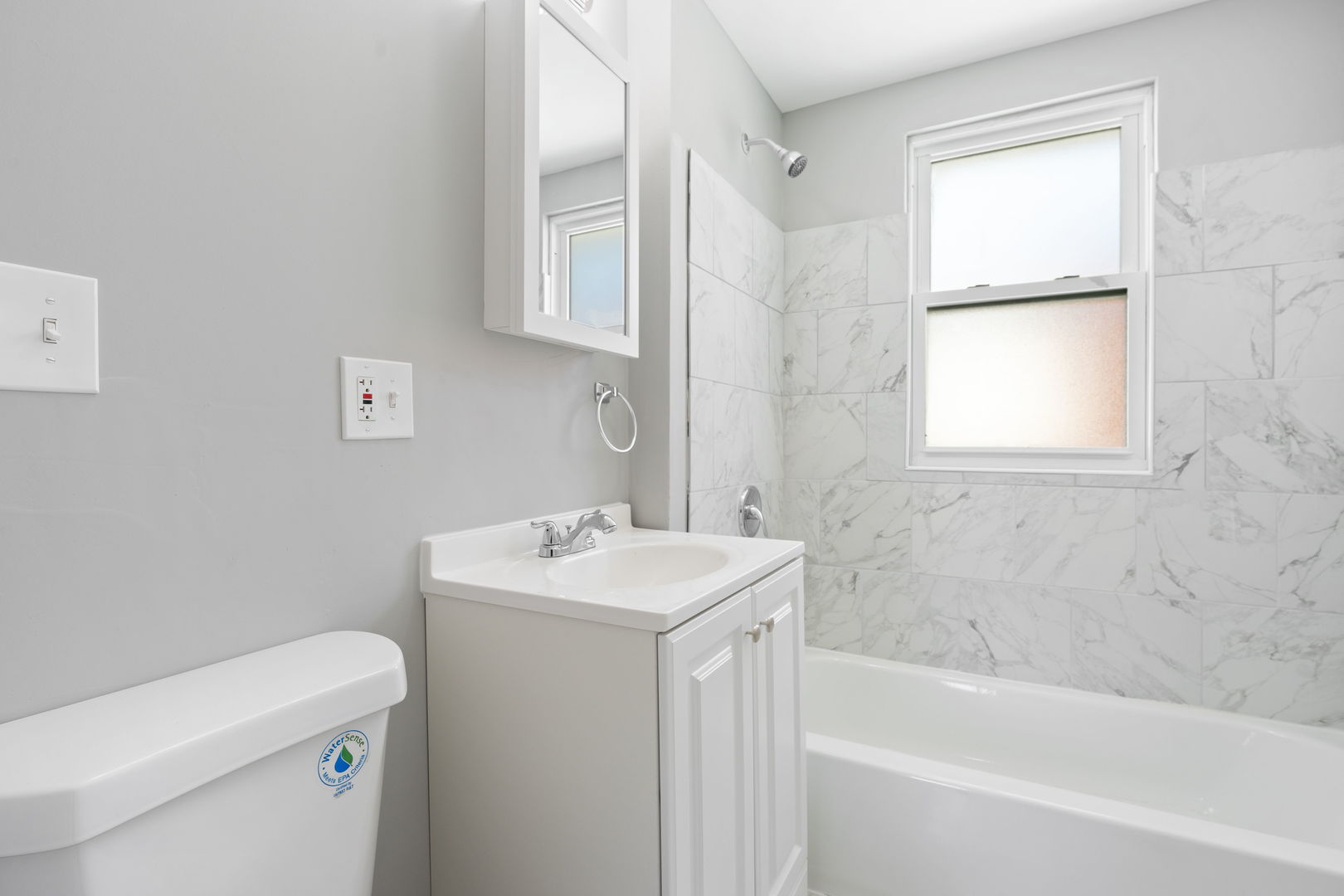 8048 South Avalon Avenue Chicago, IL 60619 - Photo 8 of 17 a bathroom with a sink a toilet and bathtub