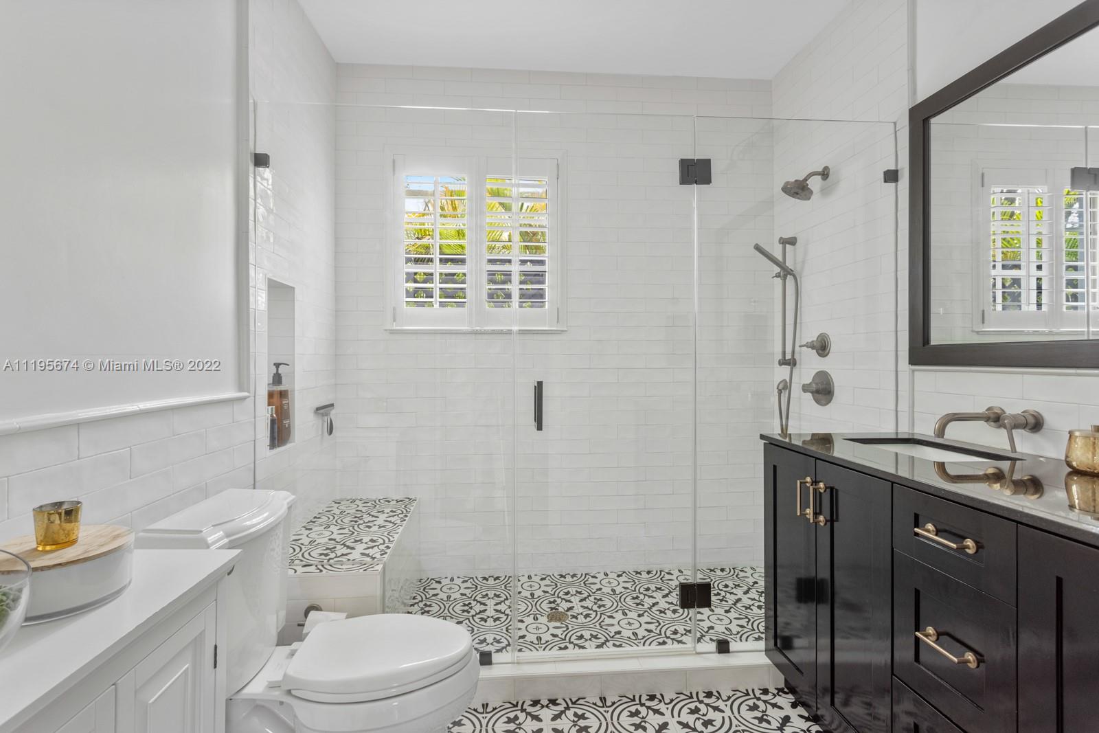 1860 Southwest 11th Street Miami, FL 33135 - Photo 13 of 30 a bathroom with a sink a toilet and shower