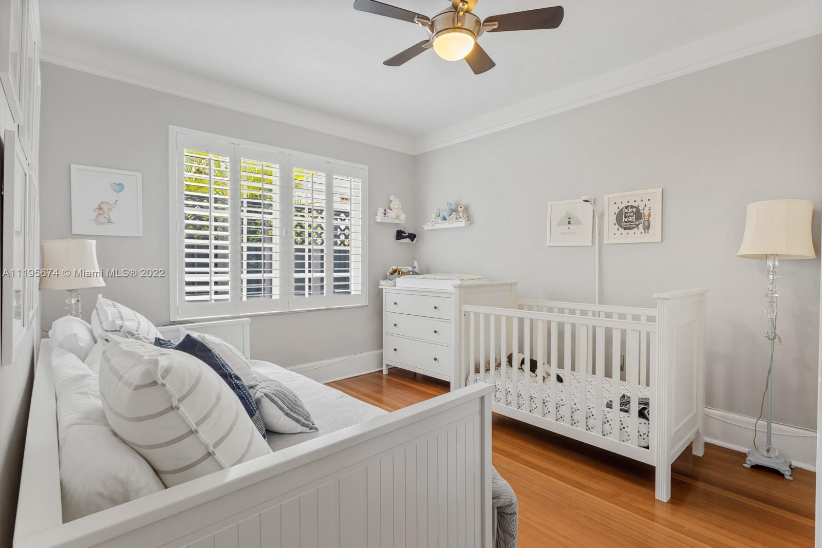 1860 Southwest 11th Street Miami, FL 33135 - Photo 14 of 30 a view of a bedroom with furniture and a window