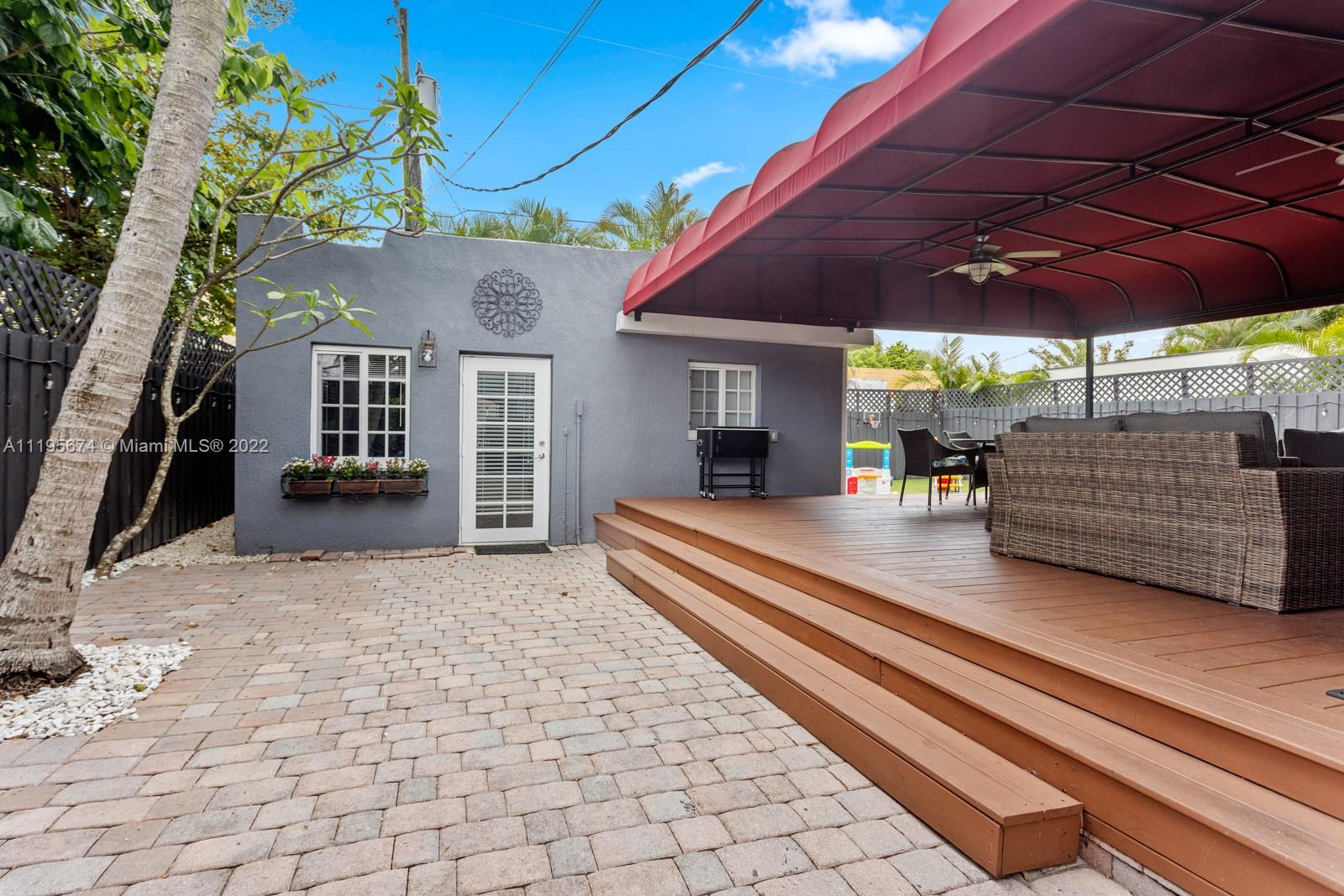 1860 Southwest 11th Street Miami, FL 33135 - Photo 18 of 30 a view of a patio with a table and chairs under an umbrella