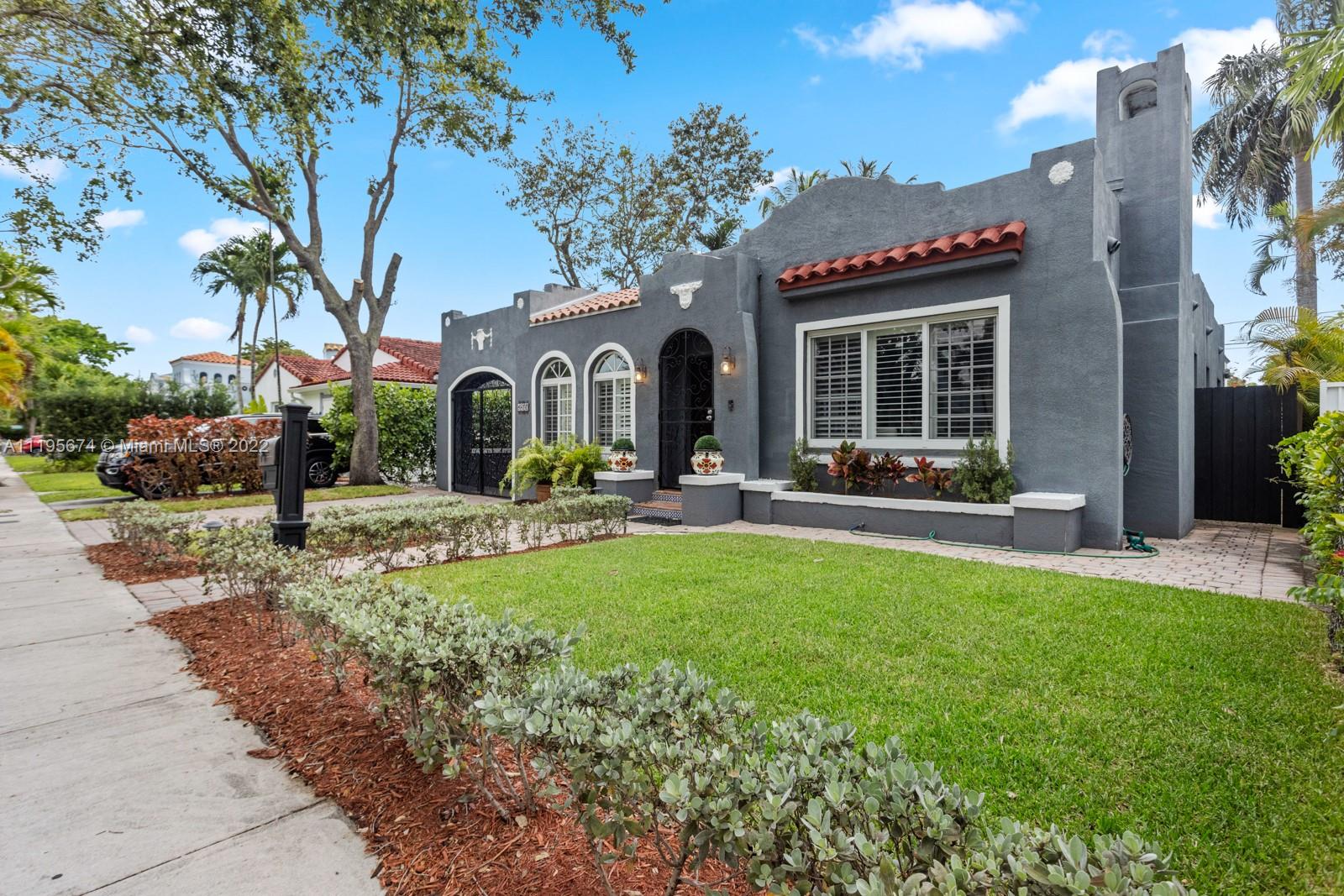 1860 Southwest 11th Street Miami, FL 33135 - Photo 2 of 30 a front view of a house with swimming pool and furniture