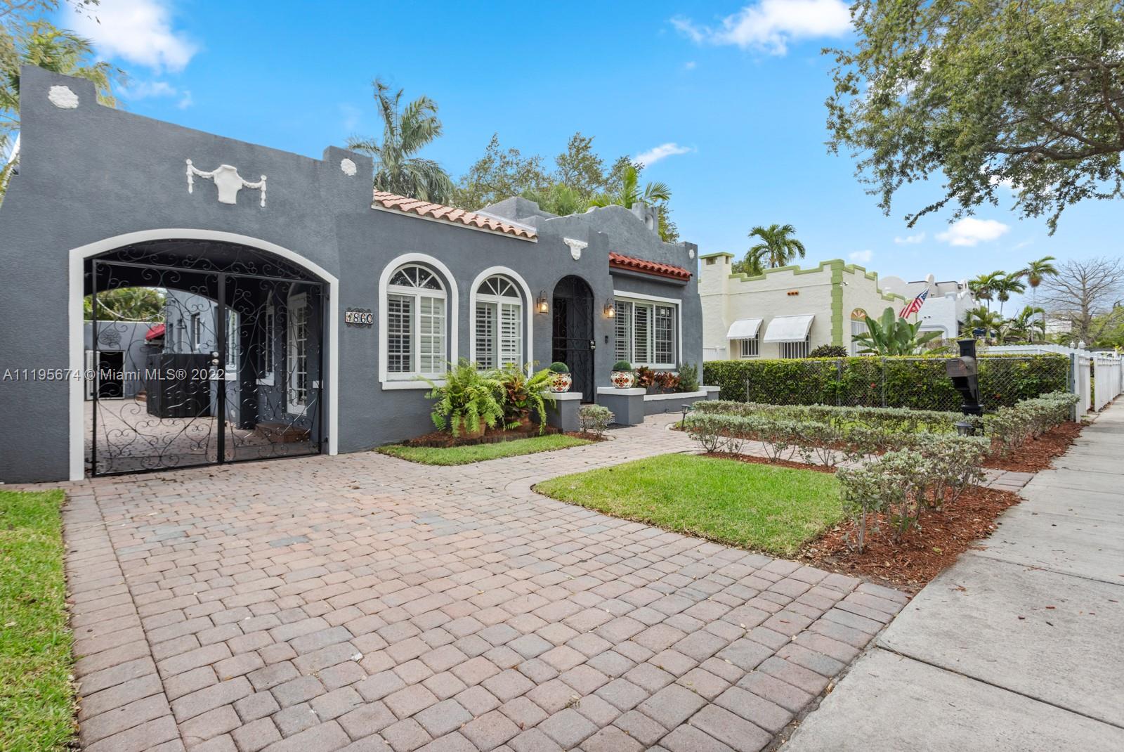 1860 Southwest 11th Street Miami, FL 33135 - Photo 29 of 30 a front view of a house with yard and a garden