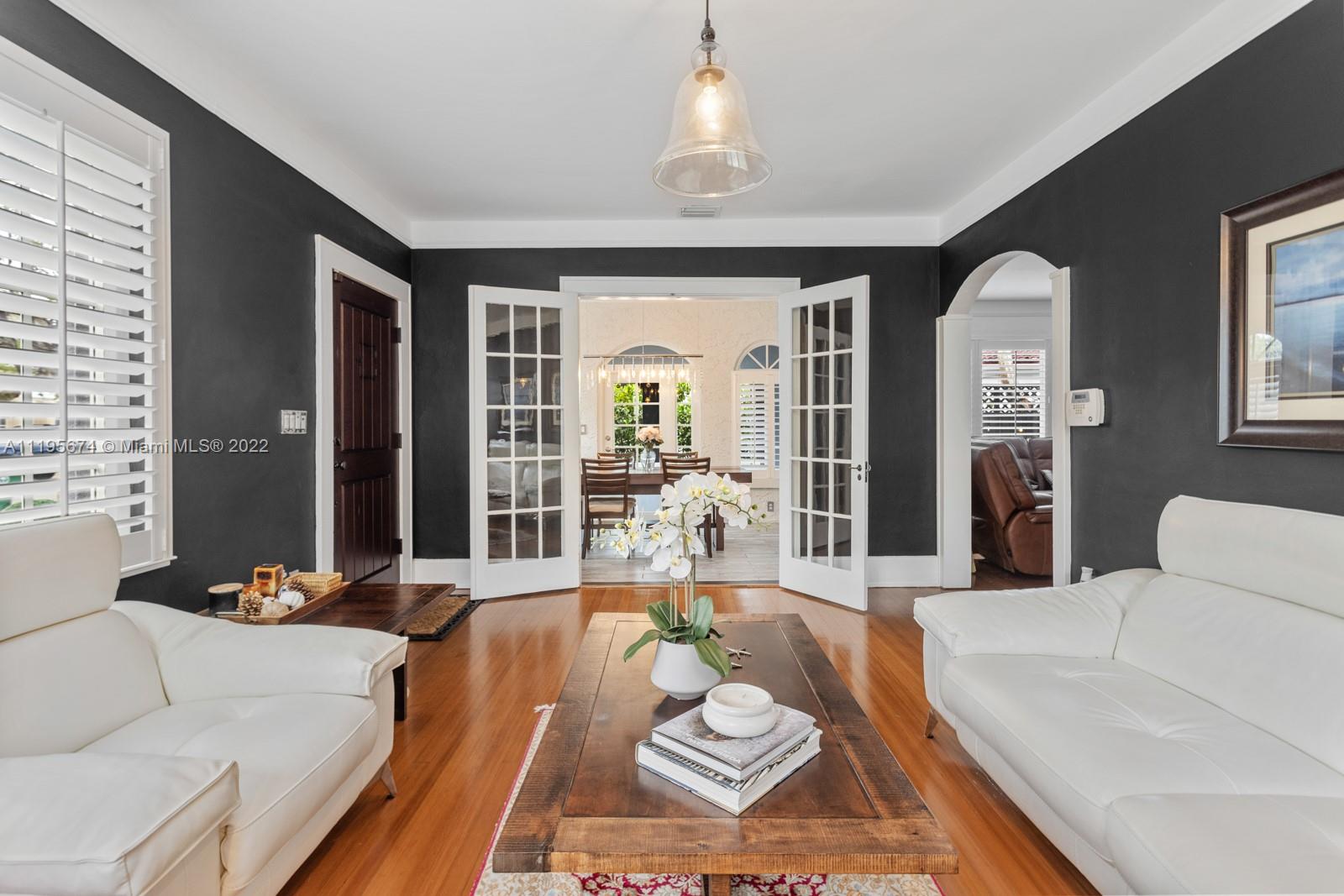 1860 Southwest 11th Street Miami, FL 33135 - Photo 3 of 30 a living room with furniture chandelier and a large window