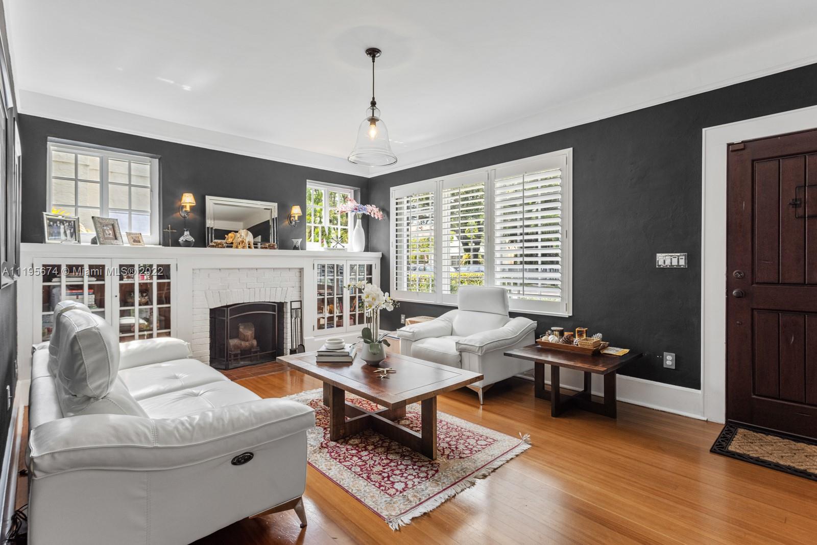1860 Southwest 11th Street Miami, FL 33135 - Photo 5 of 30 a living room with furniture a fireplace and a flat screen tv