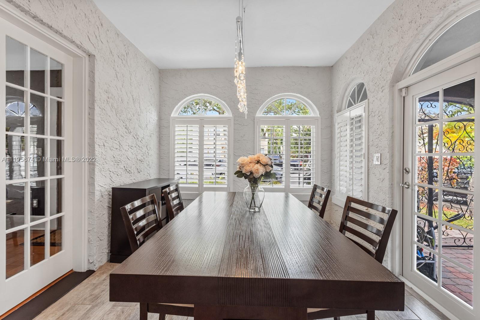 1860 Southwest 11th Street Miami, FL 33135 - Photo 6 of 30 a view of living room and dining room with furniture a rug and wooden floor
