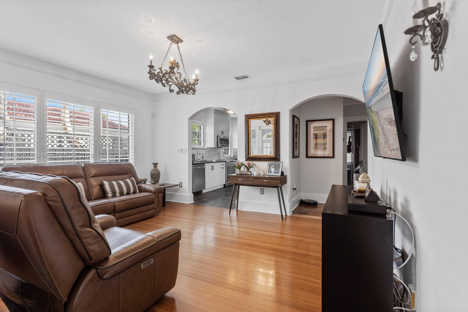 1860 Southwest 11th Street Miami, FL 33135 - Photo 9 of 30 a living room with furniture and a chandelier