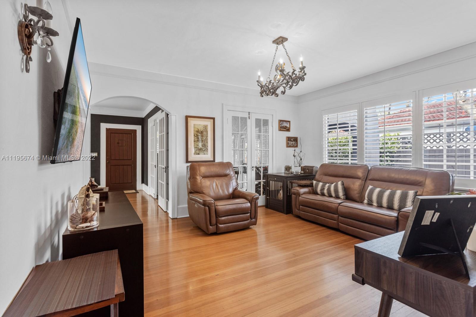 1860 Southwest 11th Street Miami, FL 33135 - Photo 10 of 30 a living room with furniture chandelier and a flat screen tv