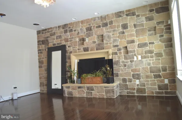 a view of wooden floor with a fireplace in it