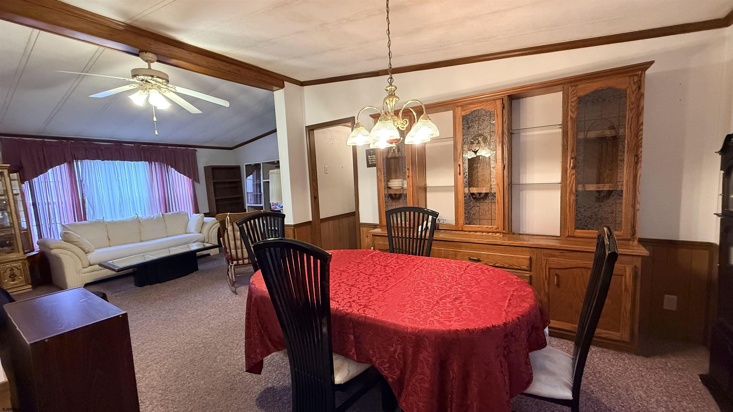 581 Miles Standish Lane Buena, NJ 08310 - Photo 14 of 32 a view of a dining room with furniture and window