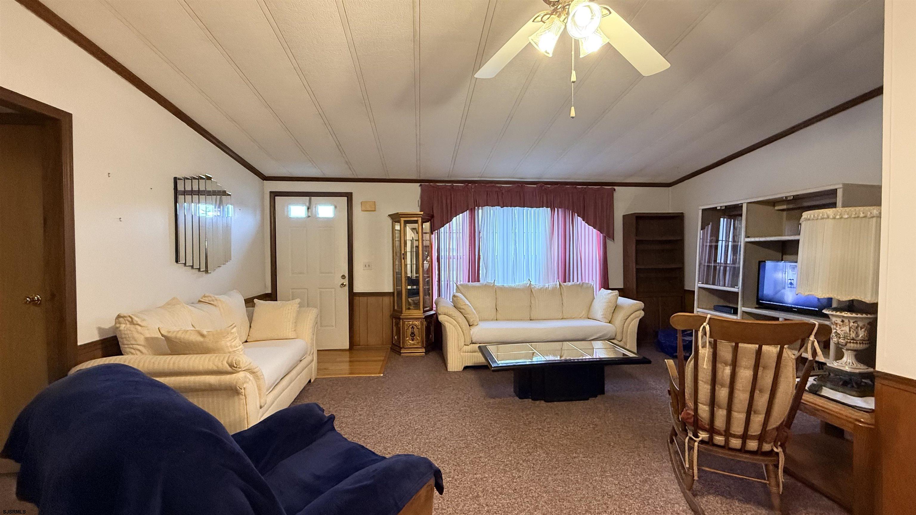 581 Miles Standish Lane Buena, NJ 08310 - Photo 15 of 32 a living room with furniture and a large window