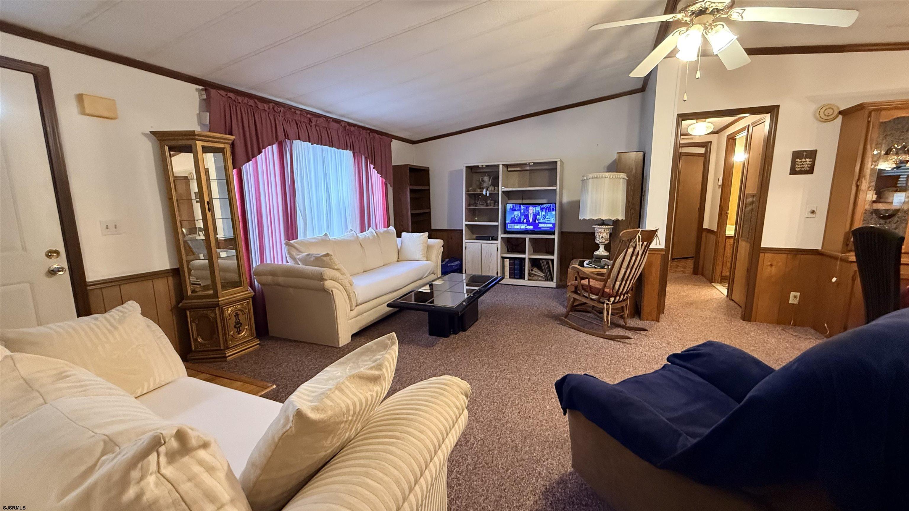 581 Miles Standish Lane Buena, NJ 08310 - Photo 16 of 32 a living room with furniture and a flat screen tv