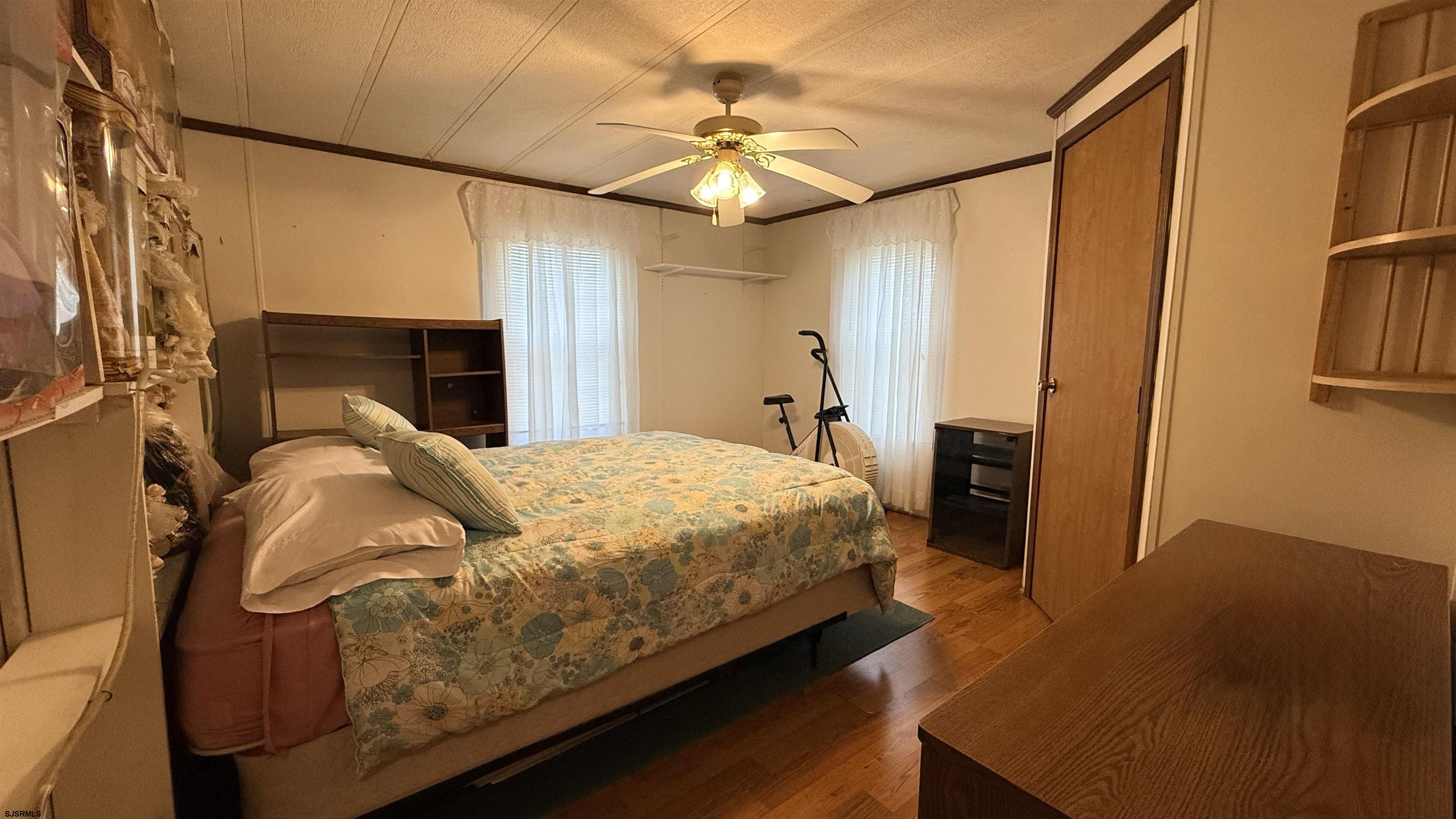 581 Miles Standish Lane Buena, NJ 08310 - Photo 20 of 32 a bedroom with a bed and a chandelier