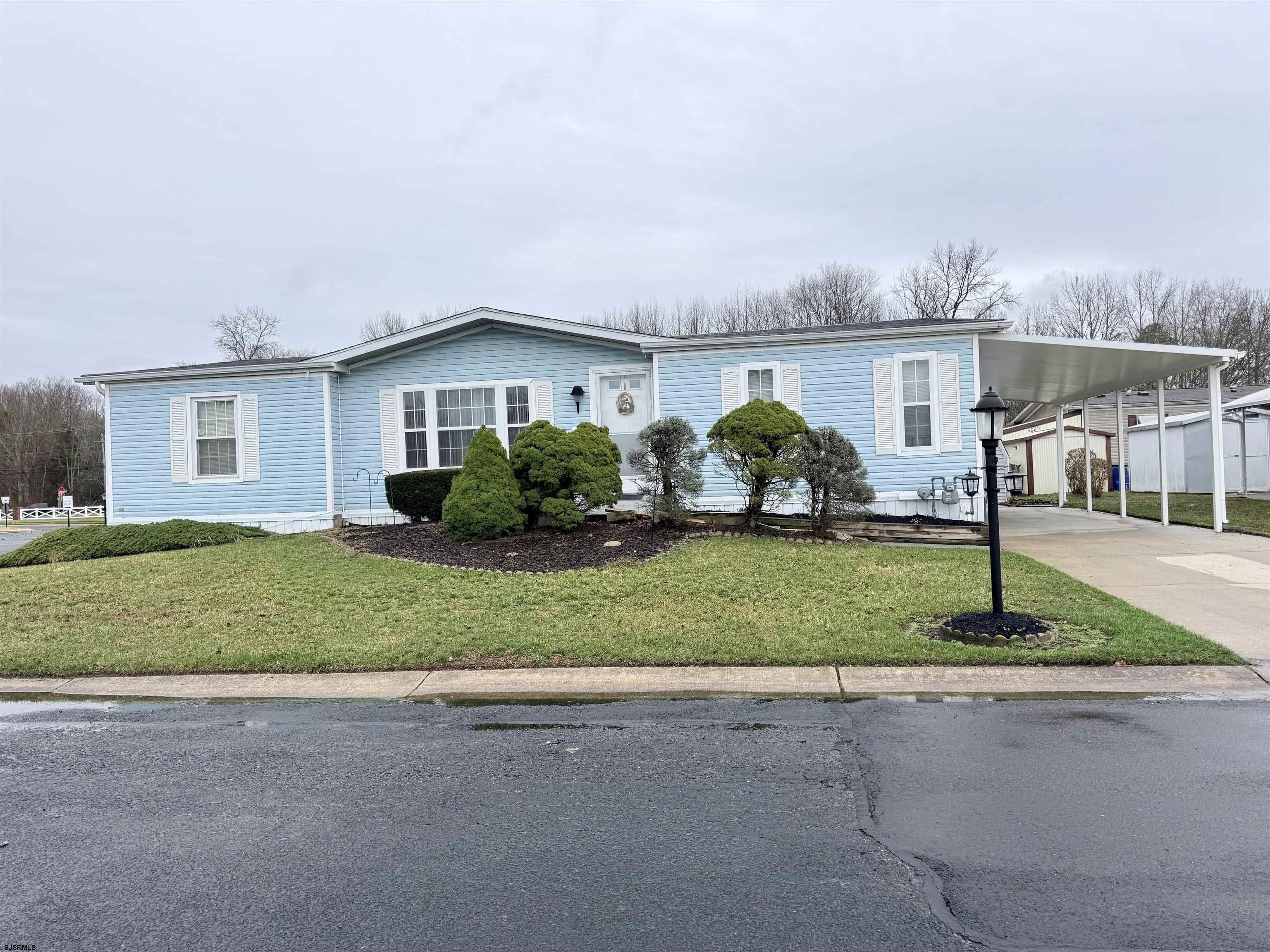 581 Miles Standish Lane Buena, NJ 08310 - Photo 2 of 32 a front view of a house with a yard and garage