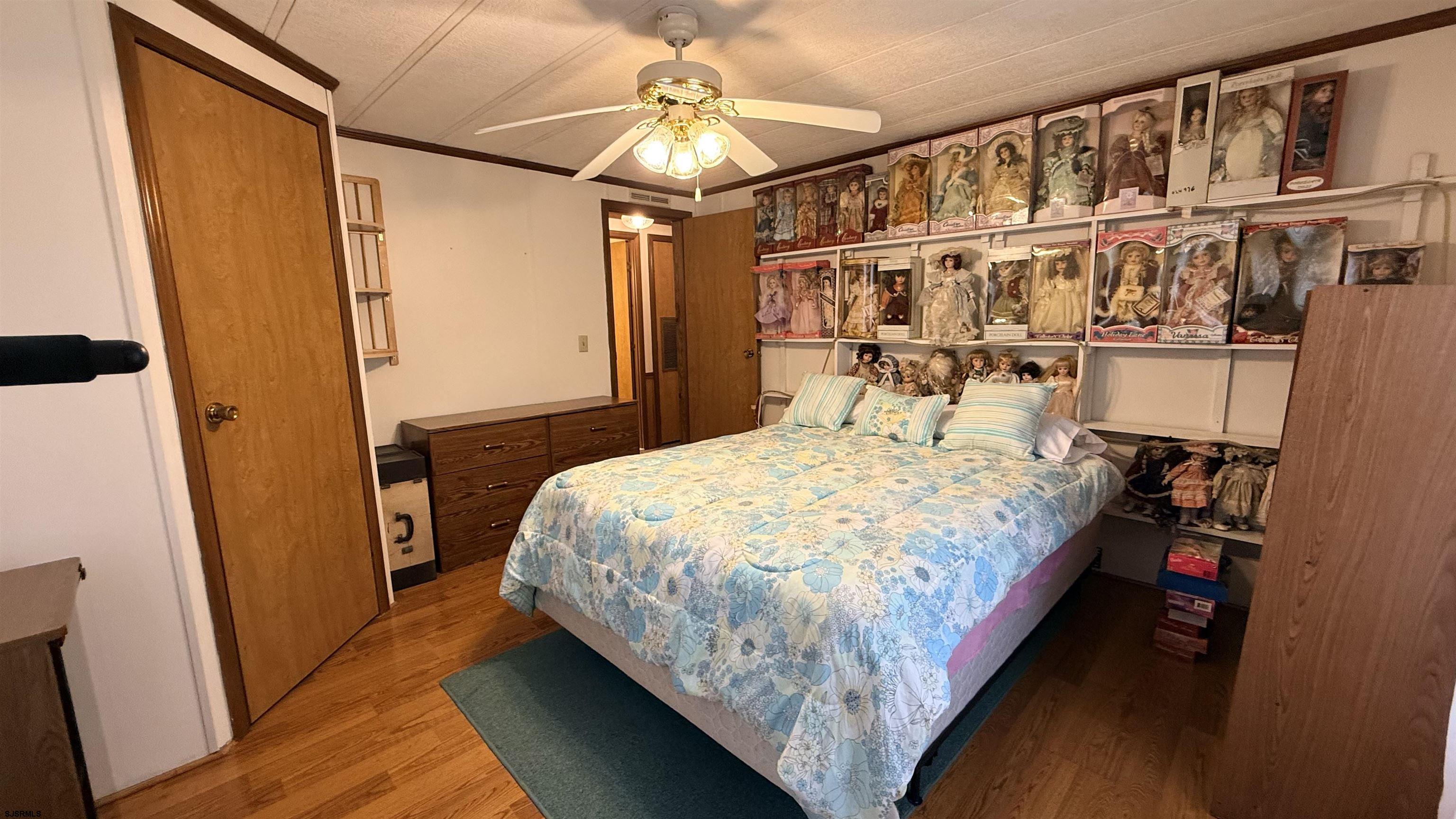 581 Miles Standish Lane Buena, NJ 08310 - Photo 21 of 32 a bed sitting in a bedroom next to a cabinet