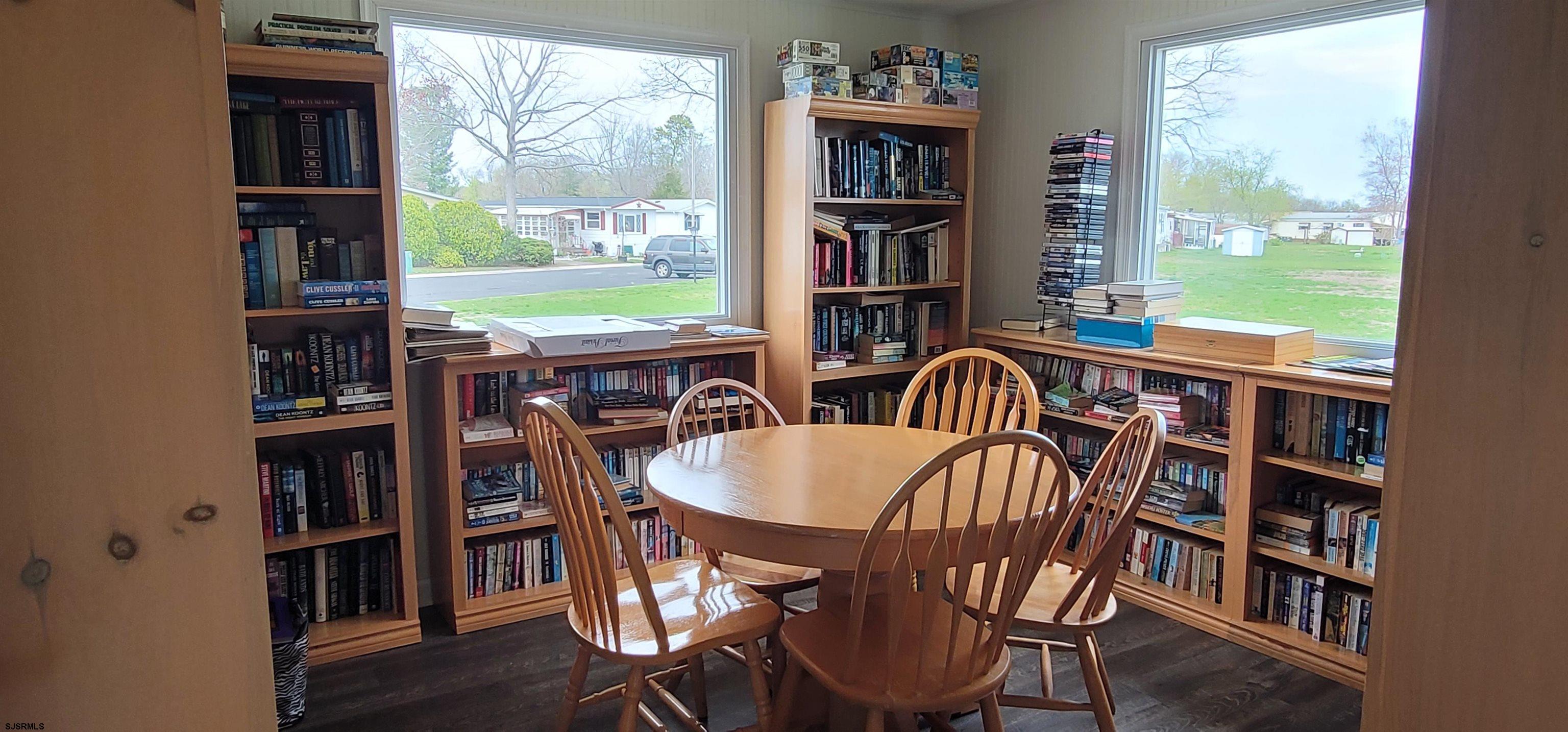 581 Miles Standish Lane Buena, NJ 08310 - Photo 30 of 32 a view of a dining room with furniture and a book shelf