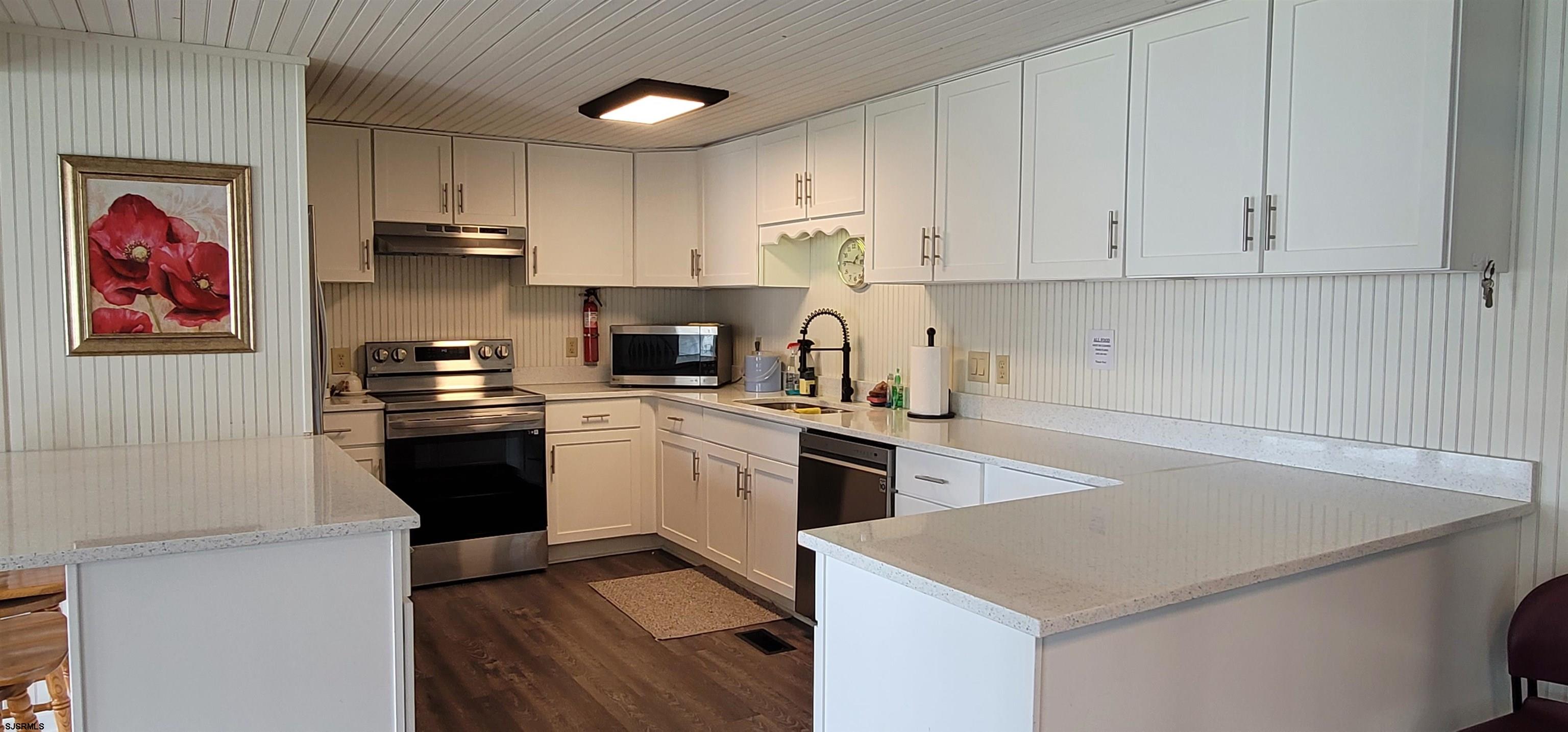 581 Miles Standish Lane Buena, NJ 08310 - Photo 31 of 32 a kitchen with cabinets appliances and a counter space