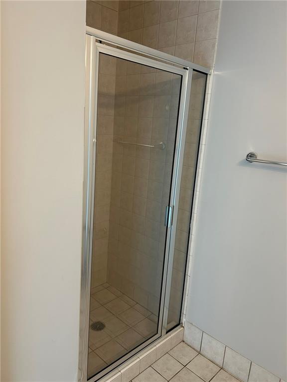 3338 Peachtree Road Northeast, Unit 2102 Atlanta, GA 30326 - Photo 12 of 14 a bathroom with a glass door shower